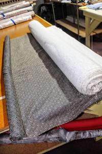 lot 6237 image: (2) Rolls of Beautiful Thick Tan and Black Decorative Fabric