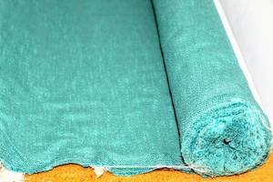 lot 6249 image: (2) Rolls of Turquoise and Off White Thicker Fabric