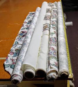 lot 6215 image: Lot of (4) Fabric Rolls including (2) 56 Rolls of White, (2) 56 Paisley Floral by Richloom, and (1) 48 Roll of Waverly