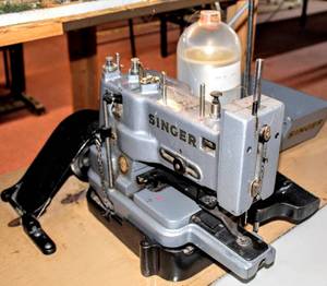 lot 6213 image: Vintage Commercial Singer Sewing Machine Bar Tacker 269W and Table with Accessories