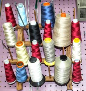 lot 6277 image: 24 Cone Spool Thread Wall Mount Rack, Wood Sewing Room Organizer and 17 Cone Thread Spools