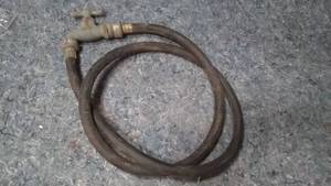 lot 554 image: Water Spigot Valve With Hose