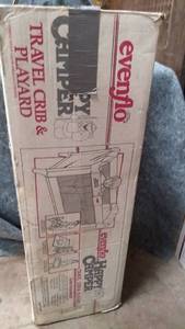lot 563 image: Evenflo Happy Camper Pop Up Crib and Playard