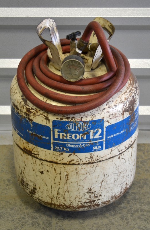lot 2063 image: Tank with hose and guage