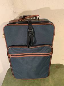 lot 9225 image: E. Boli Rolling Suitcase Location Basement