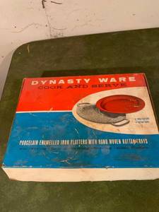 lot 9284 image: Set of 4 Dynasty Ware Porcelain Enameled Iron Platters With Hand Woven Rattan Trays Location Basement Counter
