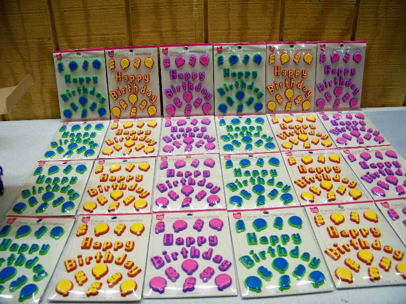 lot 1065 image: 24 Packages of Cake Mate Candy Cake Decorations