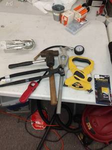lot 6514 image: Rubber malots, 100 foot tape measure other misc items