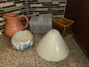 lot 1012 image: Pottery. Miscellaneous Pottery...Pitcher, Cement Box, Bowl ,vase and a cone. The brownish gold vase is a HAEGER