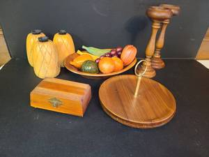 lot 1048 image: Wooden Items. Bowl of Wooden Fruit, Pineapple Candle Holders, 2 Wooden Candle Holders, Box, and 2 Serving Trays