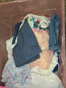 lot 1178 image: Tote full of doll clothes or a small child