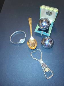 lot 1518 image: John F. Kennedy Spoon, Stress Balls, Jeweled Can Opener and Ladies Watch...Careville is the brand