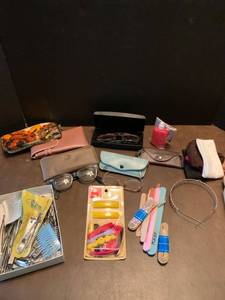 lot 2250 image: Assorted eye glasses with case nail clips and scissors nail files