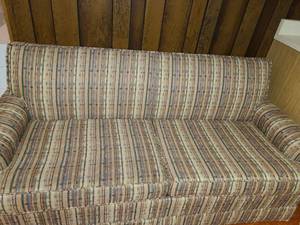 lot 3043 image: Patterned Couch Hide a bed. Not too heavy and it has wheels.