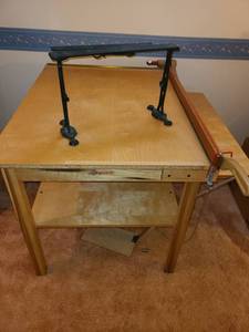 lot 3324 image: Paper Cutters. Wooden is Attached to Table. 30 x 37. Rod Iron paper cutter is 13 x 18 x 6