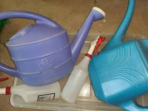 lot 5019 image: 2 Plastic Watering Cans and 2 Plastic Squirt Bottles