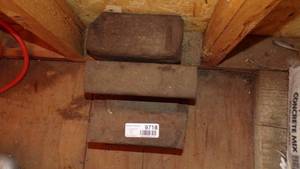 lot 9718 image: IRON RAIL PIECES AND BRICK