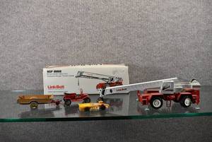 lot 1376 image: Lot of 4 Vintage Die-Cast Collectibles  Includes a NZG Modelle Link-Belt Rough Terrain Crane (with box) Lesney Ford Model T (missing Front Seat) Dinky Toys Halesowen Farm Trailer