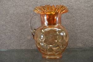 lot 1401 image: Fenton Orange Carnival Glass Opalescent Ruffled Pitcher  Coin Dot Crimped Edge Design  9-12 Tall