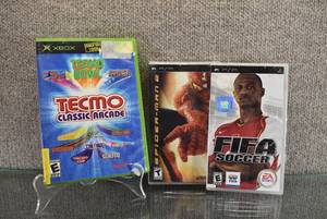 lot 1415 image: Lot of 3 Video Games - Spiderman 2 (PSP), FIFA Soccer (PSP), Tecmo Classic Arcade (Original XBOX)