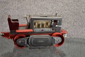 lot 1469 image: Vintage Nomura Japan Tin Litho Battery Operated 1200 Lighted Piston Action Tractor  Untested