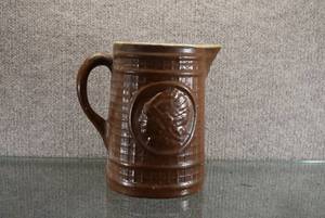 lot 1487 image: Vintage Stoneware Indian Head Pitcher  8 14 Tall
