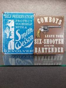 lot 1593 image: Lot of 2 Smith & Wesson Cowboy Six-Shooter Metal Signs  Great for Man Cave  12 x 16, 12 x 15