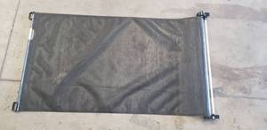 lot 4344 image: 34 Retractable Saftey Gate. Net Is 32 x 53. Missing Wall Mounts