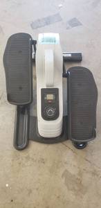 lot 4356 image: Sunny Health Under Desk Eliptical. Electronics Work But Does Not Track Movement. Missing One Stabilizer Skid Protection Pad On Front