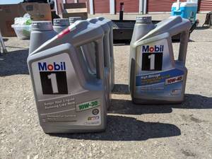 lot 2942 image: Full Synthetic Motor Oil, 3-10w 30 One Is Full Two Quarter Or Less Full, 10W40 Is Almost Full