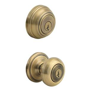 lot 69 image: Kwikset 991 Juno Entry Knob and Single Cylinder Deadbolt Combo Pack featuring SmartKey� in Antique Brass