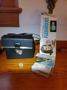 lot 2130 image: Vintage Camera Accessories. Bag ,Slides and Bulbs