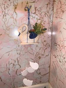 lot 6269 image: Goose Wind Chimes Location Bathroom