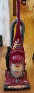 lot 6286 image: Bissell Burgandy Vaccum. Tested and Working