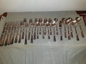 lot 8556 image: Twenty Six Piece of Silver Plated Eating Utensils in Dark Red Case