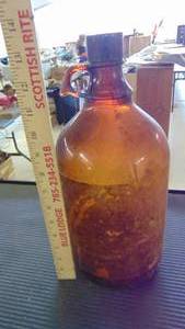 lot 10016 image: old yellow glass jug