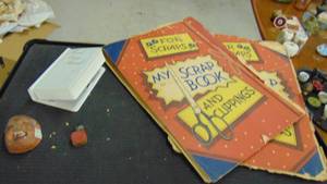 lot 10053 image: old scraping book - mini mask (creepy) coin bank book