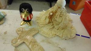 lot 10087 image: foot prints cross - lace doll and 1st Nat bank duck