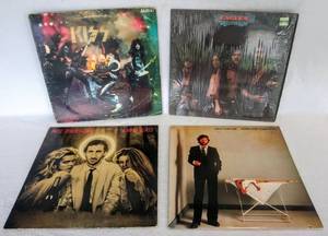 lot 5416 image: 1975 KISS Alive, 1983 Eric Clapton, 1973 Eagles Desperado & 1980 Pete Townsend Empty Glass