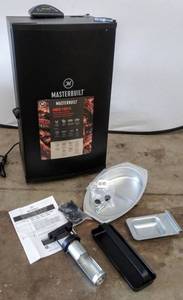 lot 2137 image: Masterbuilt MES 130B Digital Electric Smoker - Model # MB20071117  Tested & Appears to be Working (Dented)