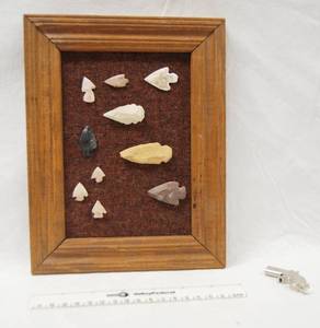 lot 8019 image: Picture Frame w Collectible Arrow Heads, and a Small Gun Trinket