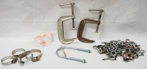 lot 2990 image: Lot of Different Clamps, Ear Plugs, Eye Hooks, and Misc.