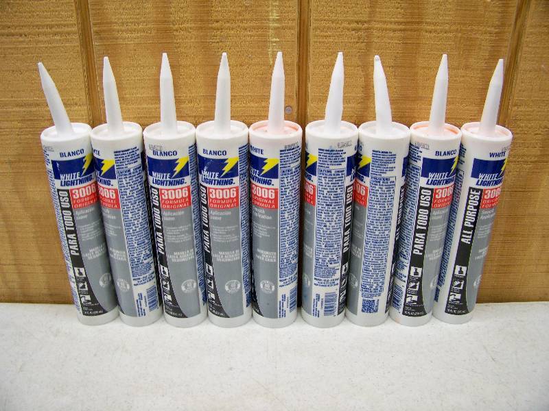 lot 1124 image: 9 Tubes All Purpose White Lightning Siliconized Acrylic Latex Caulk