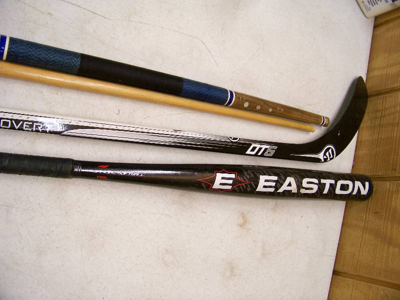 lot 1402 image: Softball Bat, Hockey Stick, Pool Cue