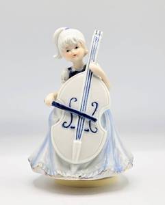 lot 5102 image: Young Girl Playing Cello Porcelain Musical Figurine