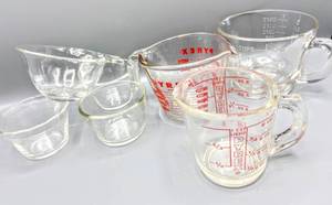 lot 5069 image: Vintage Pyrex Measuring Cups and (3) 4 ounce Custard Dishes