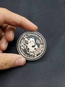 lot 2034 image: 1991 China $10Y Piefort 2oz Panda Silver Coin