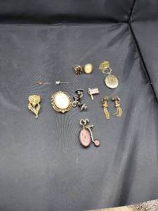 lot 2130 image: Lot of Womens Locket, 2 Rings, Pair of Earrings, and Various Pins