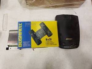 lot 2279 image: Bushnell Binoculars and Escort Passport Laser Detector with Money Clip