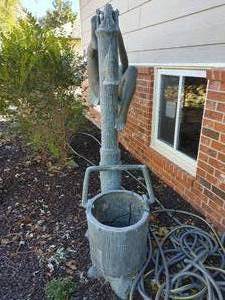 lot 1 image: Lifesize Bronze Statue- Child hanging on pitcher pump water fountain w water pump
